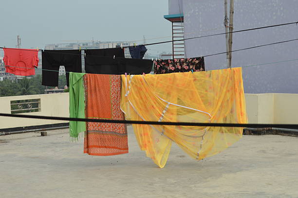 istock Vividly Colored Clothes Drying on Outdoor Rooftop Lines 2209132862
