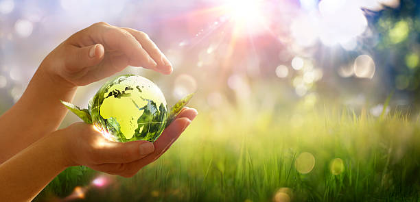 istock Earth Day - Green Globe In Hands - Environment Protection - Defocused Abstract Background 2209135961