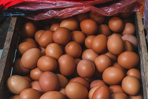 istock Brown Chicken Eggs in a Traditional Market Box. 2209136400