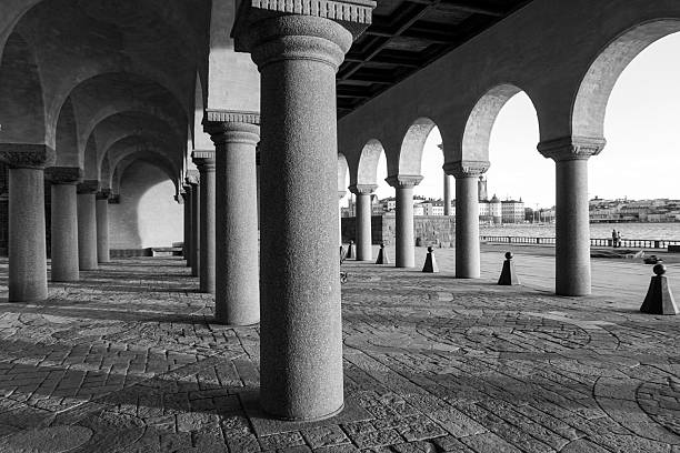 Woman walking alone in a large corridor