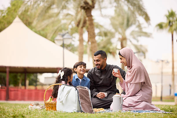 istock Father and mother having fun with children 2209144141
