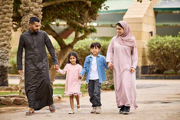 istock Family strolling with each other at park 2209144151