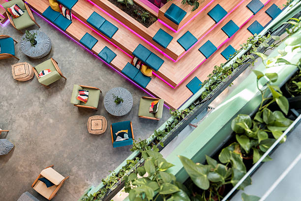 istock Bright Contemporary Office with Tiered Seating and Vibrant Greenery 2209151686
