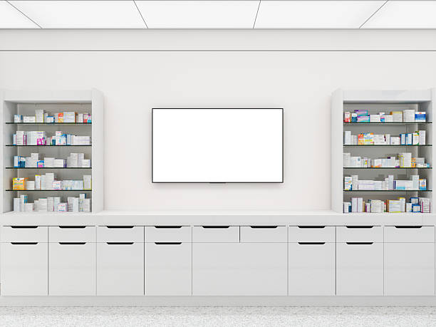 Pharmacy With Front View Of White Cabinets, Medicines On The Racks And Blank Screen