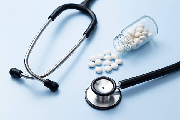 istock Stethoscope and pills on a blue background. 2209154885