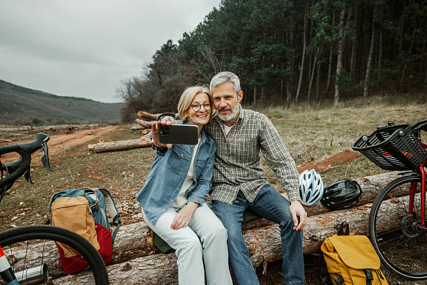 istock Mature cycling couple taking a break and snapping a selfie 2209156551