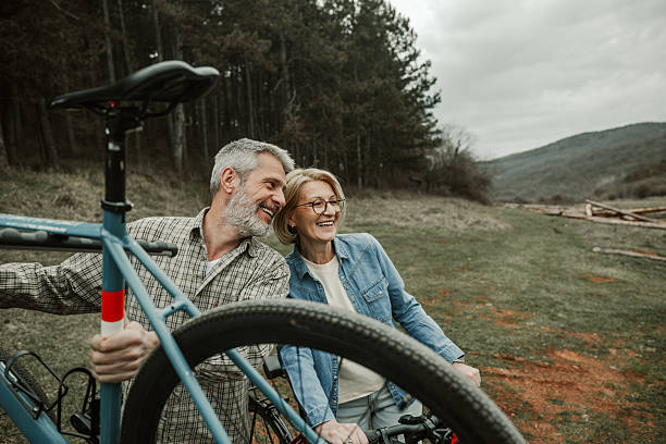 istock Mature couple unloading bicycles from car bike rack 2209156651