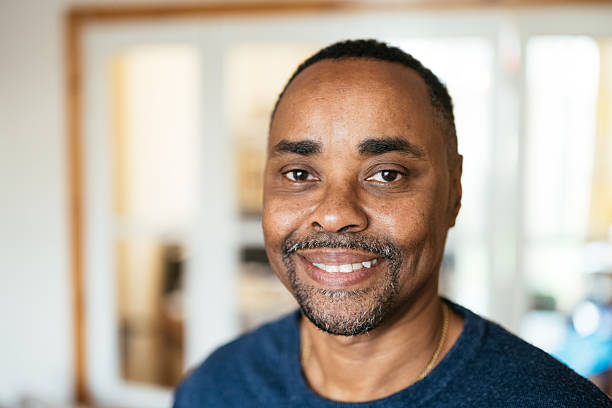 istock Senior black man smiling and looking at camera 2209156838