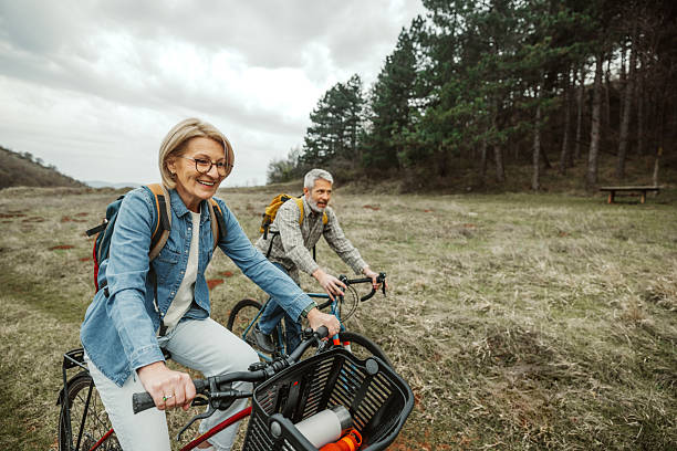 istock Active retired couple biking in the woods 2209156977