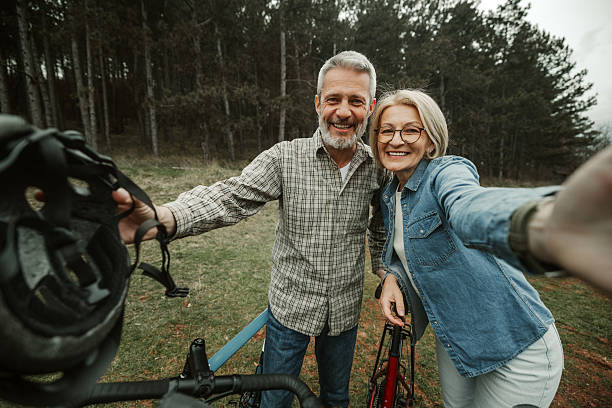 istock Mature cycling couple taking a break and snapping a selfie 2209157073