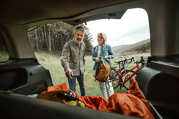 istock Mature couple unloading car for cycling adventure 2209157079