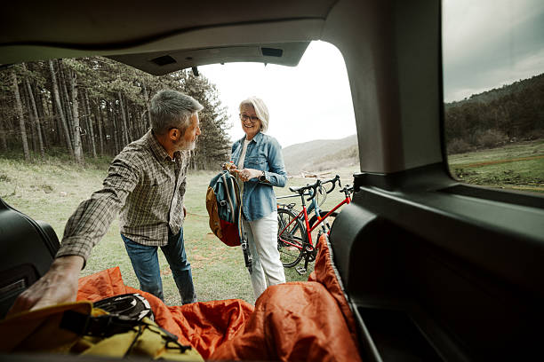 istock Mature couple unloading car for cycling adventure 2209157115