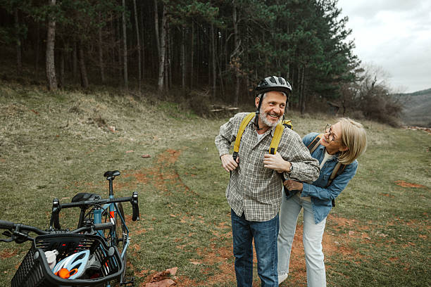 istock Mature couple preparing for forest cycling trip 2209157164