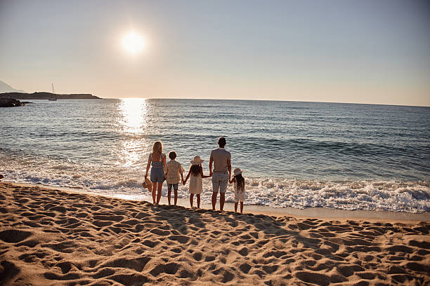 istock A family enjoying a tropical paradise beach during sunrise 2209158263