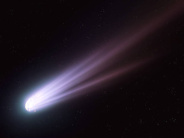 istock Comet with bright tail in space. Shooting star in the sky. 2209159633