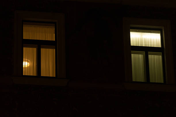 istock Illuminated Windows in Dark European Old Town. Intricate architecture details. 2209159644