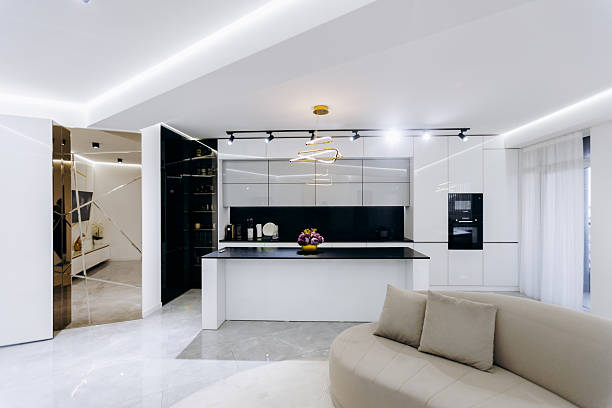 istock A cozy living room with a comfy couch and kitchen behind 2209160127