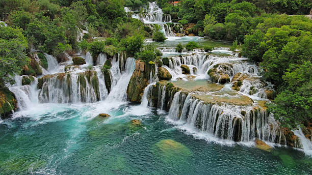 Aerial view of beautiful Krka Waterfalls in Krka National Park, green foliage and turquoise water, Croatia