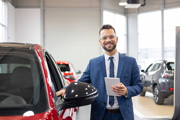 istock Businessman by a car using a digital tablet 2209164023