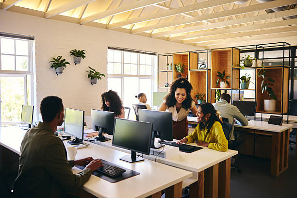 istock Business professionals working in office on computers 2209164412