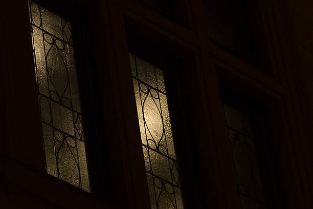 istock Illuminated Windows in Dark European Old Town. Intricate architecture details. 2209165243
