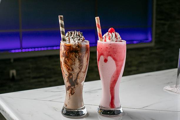 istock Chocolate and strawberry milkshakes with whipped cream 2209167601