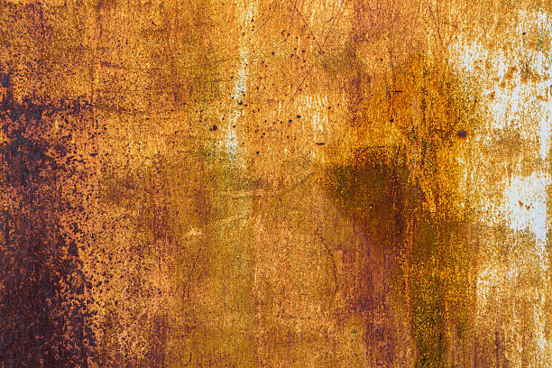 istock Rust covered metal with white paint traces 2209167923