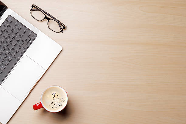 istock A clean and minimal desk setup featuring a laptop and a coffee cup 2209169089