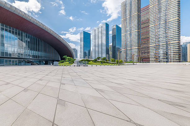 istock Empty brick floor with modern city buildings background on sunny day. 2209169507
