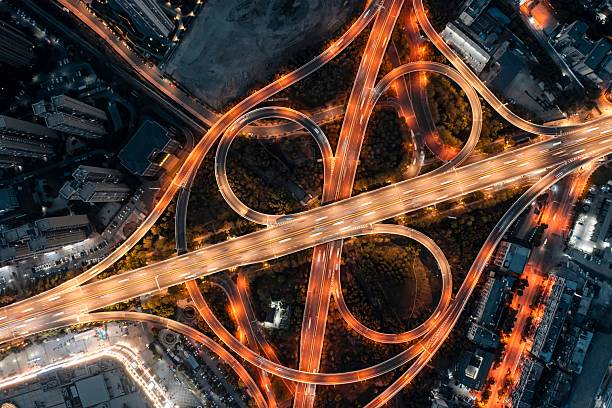 istock Aerial view of illuminated highway interchange at night. 2209170695