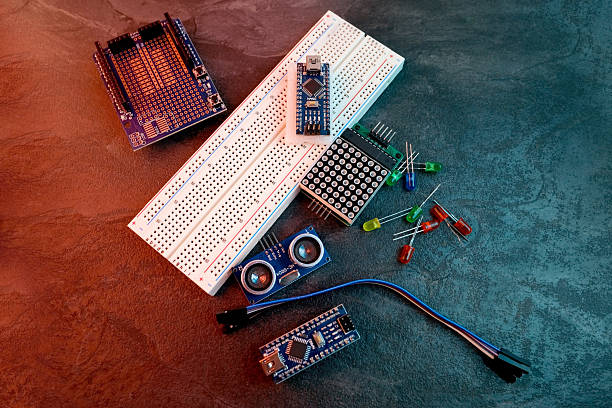 Electronics components, Breadboard in box with jumper wires and breadboard, symbolizing DIY projects, circuit building, electronic prototyping, hobby technology, electrical engineering