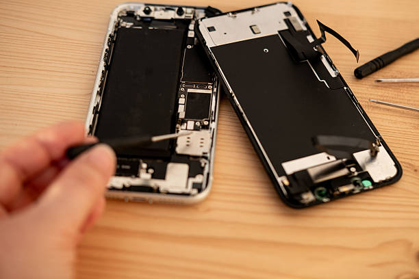 istock Hands repairing smartphone hardware with small tools. Mobile phone maintenance, repair service and technology concept, technical support, service center, display replacement 2209173560