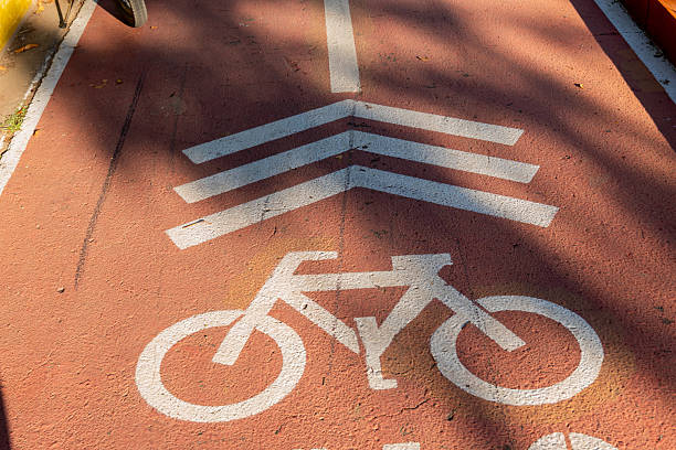 istock Bicycle Lane Symbol on Urban Sidewalk 2209173781