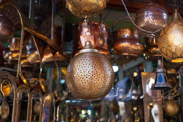 istock Traditional Moroccan lantern with ornate design, decorative artistry lighter, oriental lamp, detailed patterns and cultural african craftsmanship, intricate metalwork, warm spectrum 2209175421
