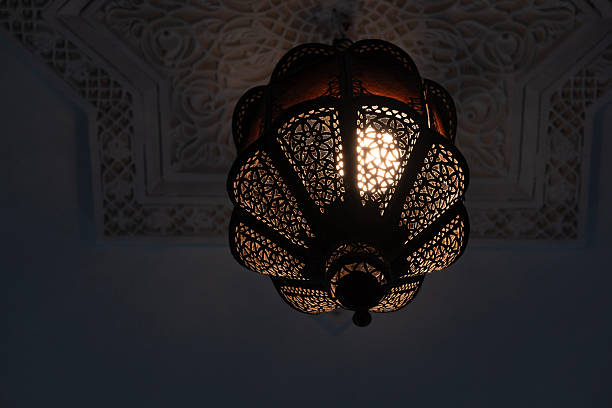 istock Traditional Moroccan lantern with ornate design, decorative artistry lighter, oriental lamp, detailed patterns and cultural african craftsmanship, intricate metalwork, warm spectrum 2209176452