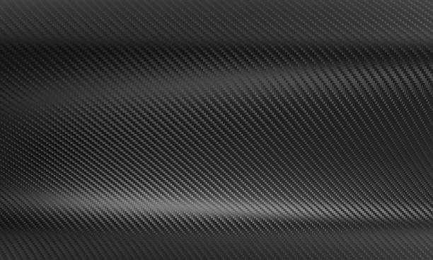istock Wavy carbon fiber texture reflecting light in dark gray tones 2209177749