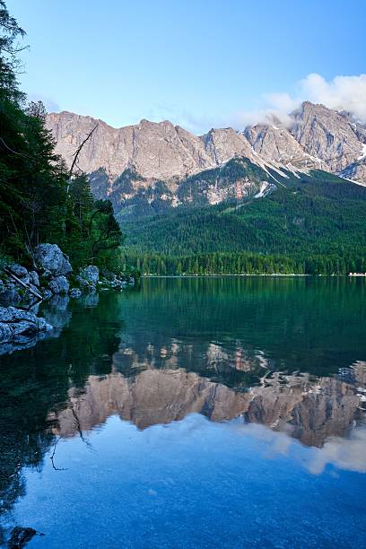 istock Serene mountain landscape with lake reflection. 2209178523