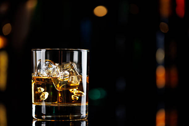 istock Whiskey on the rocks on a bar table 2209178887