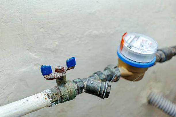 istock Old rusty water valve and meter close-up 2209179346