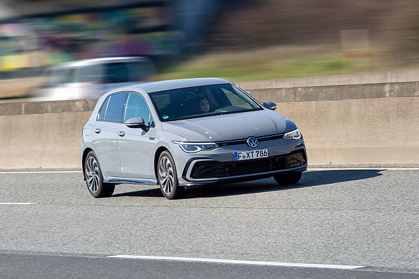 Diedenbergen, Germany - March 20, 2025: A Volkswagen Golf VIII on a highway nearby Wiesbaden, Germany. The Volkswagen (VW) Golf is a small family car made by the german car manufacturer Volkswagen since 1974. VW is a brand of the Volkswagen Group, which is a German automobile manufacturing group based in Wolfsburg, Germany and founded in 1937.