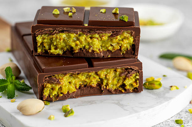 istock Dubai chocolate with kadayif dough and pistachio paste. Trend dessert on a board on a concrete background. Copy space. 2209179833