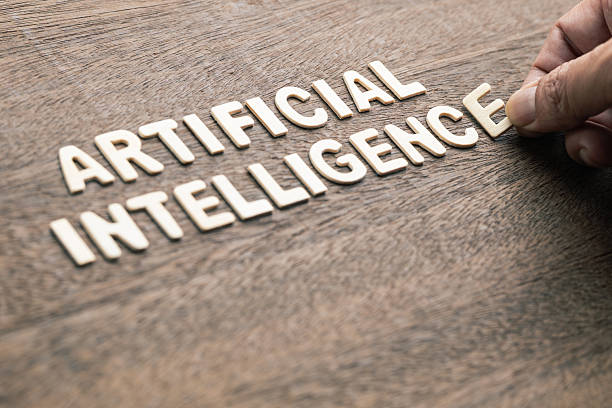 istock Hand arrange the small wooden letters as Artificial Intelligence word 2209179841