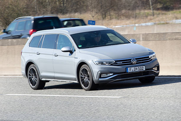 Diedenbergen, Germany - March 20, 2025: A VW Passat B8 on a highway nearby Wiesbaden, Germany. The VW Passat is a station wagon, produced by VW. VW is a brand of the Volkswagen Group, which is a German automobile manufacturing group based in Wolfsburg, Germany and founded in 1937