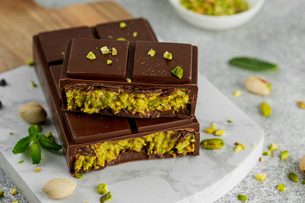 istock Dubai chocolate with kadayif dough and pistachio paste. Trend dessert on a board on a concrete background. Copy space. 2209179915