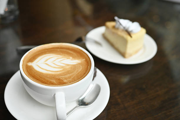 istock Savor the Moment: Latte Art and Cheesecake on Glass, Framed in Stillness 2209181899