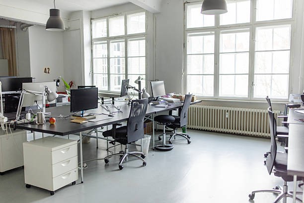 istock Coworking desks in a brightly lit office space 2209182503