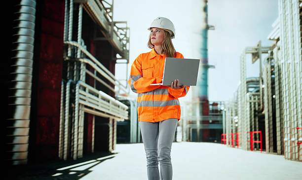 istock Quality Control In Energy Industry: Woman Inspecting Pipeline 2209182668