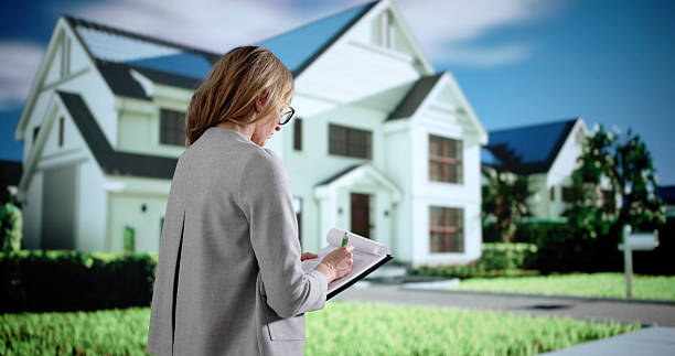 istock Happy Real Estate Agent Inspecting Property For Appraisal 2209182731