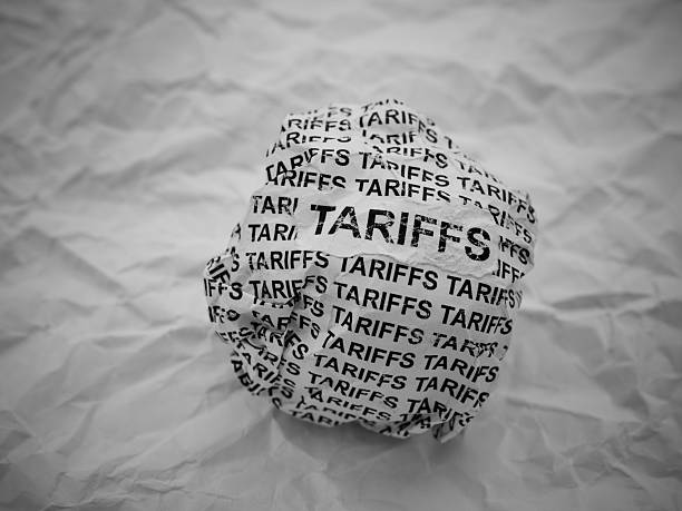 istock Crumpled paper ball with words Tariffs on a crumpled white paper background. 2209183260