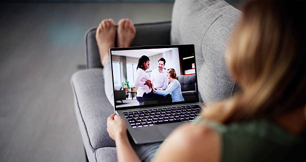 istock Young Woman Watching Video On Laptop 2209183345